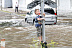 Затопленная дорога под железнодорожным мостом на Аллее Смелых в День города в Калининграде. Июль.